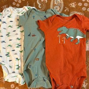 Bundle of three short sleeved onesies by Carter’s; 12 mo